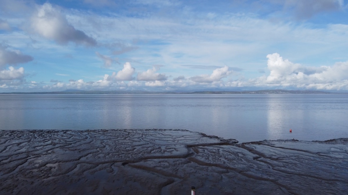 Morecambe Bay at low tide, with the Lakeland fells across the water